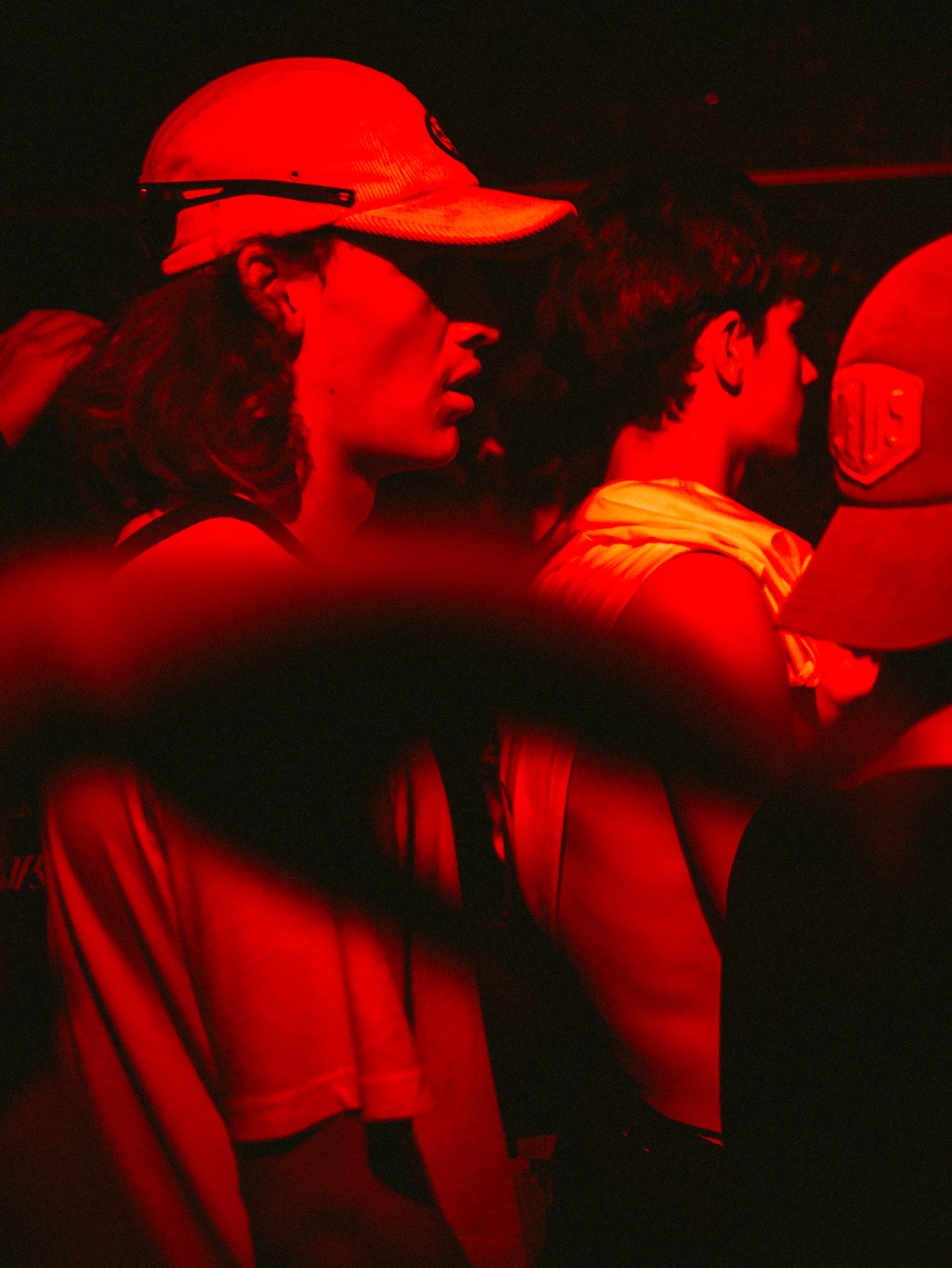 Ravers in red light at Hard Signal